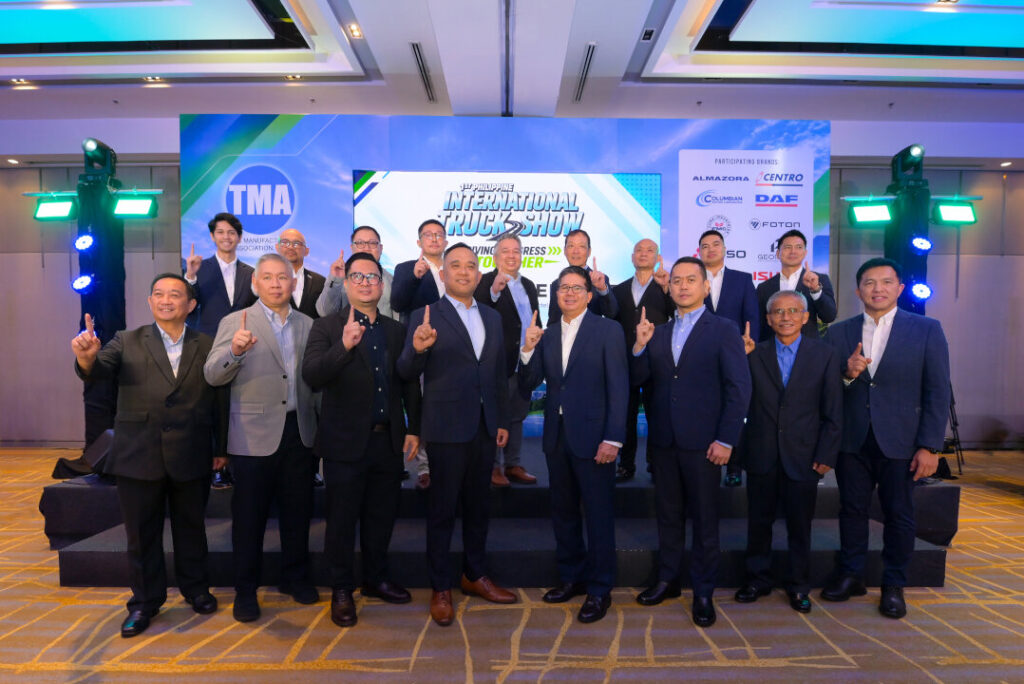 TMA and ABMAP executives pointing index fingers up during the 1st Philippine International Truck Show press conference