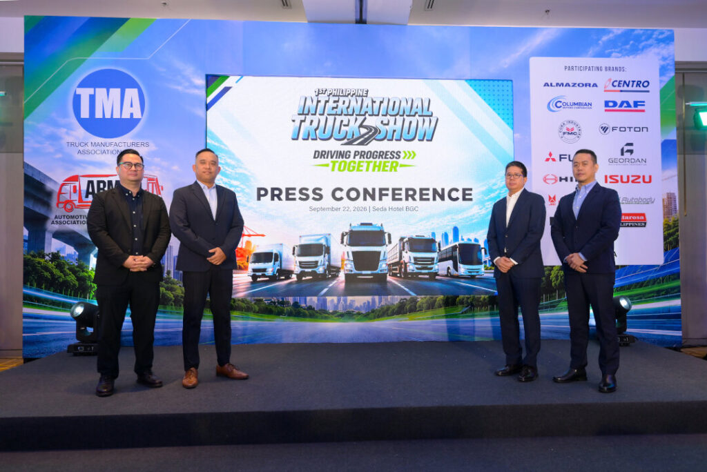 TMA and ABMAP officers standing on stage in front of the 1st Philippine International Truck Show digital backdrop at Seda Hotel BGC