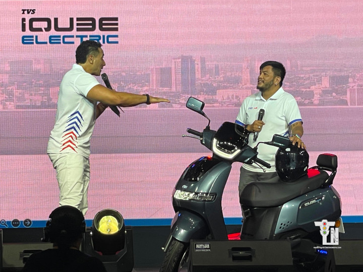 TVS iQube S electric scooter in glossy finish showing front disc brake and compact commuter design