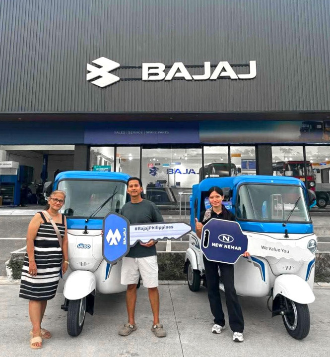 Jay Mark Aquino posing with his Bajaj Wego P5009 electric vehicle in Pangasinan for his data network business