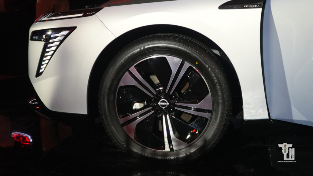 Close-up side profile of the Nissan Primera EV wheels and high-performance tires engineered for instant electric power delivery