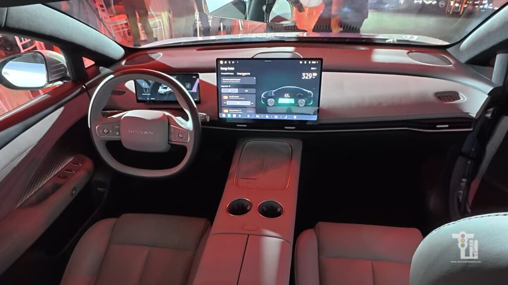 Nissan Primera EV dashboard featuring a 15.6-inch floating touchscreen display, digital instrument cluster, and premium cabin trim