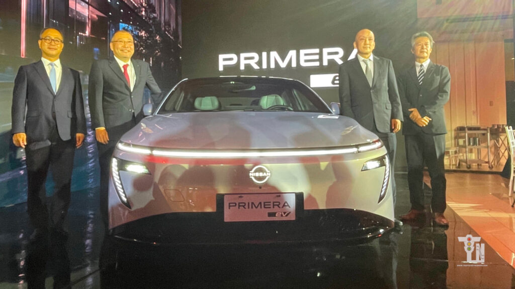 Nissan executives posing alongside the all-new Nissan Primera EV sedan during its official Philippines market reveal