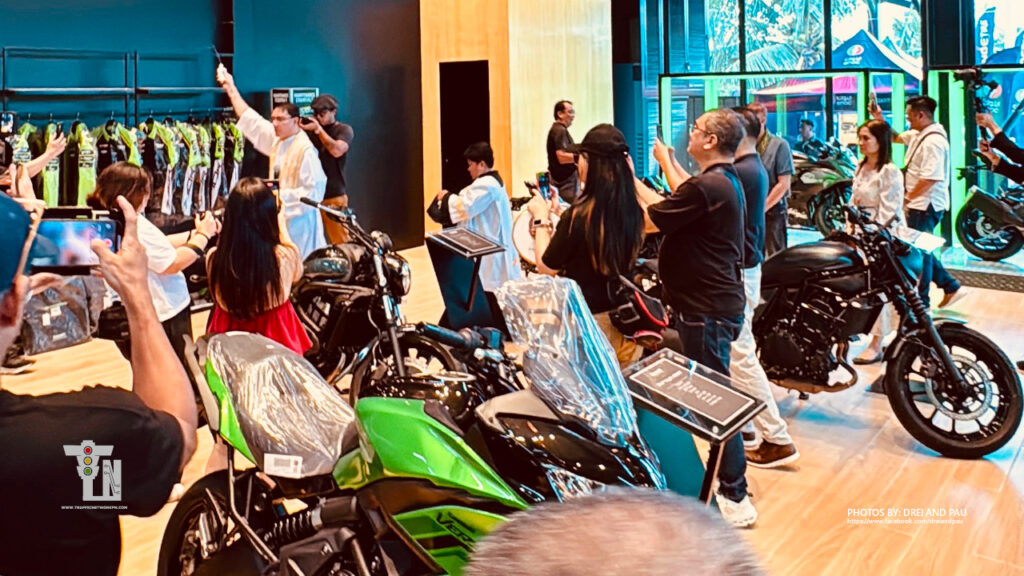 Priest officiating store blessing inside Kawasaki Leisure Bikes Lucena showroom surrounded by big bikes
