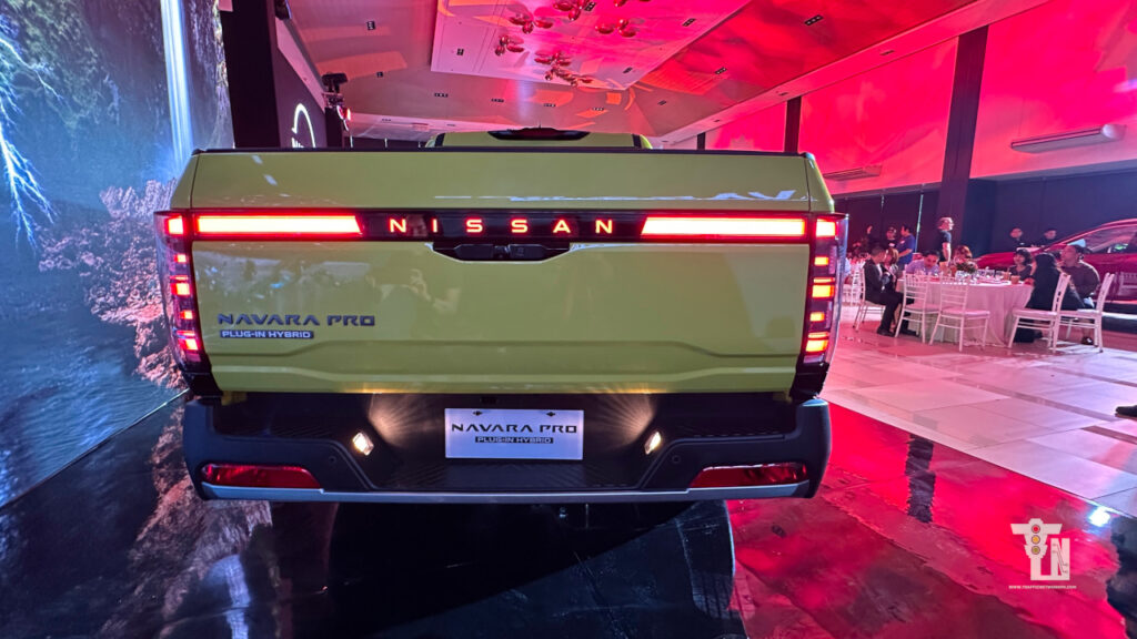 Rear perspective shot of the Nissan Navara Pro PHEV highlighting the power tailgate and rear cargo bed accessibility