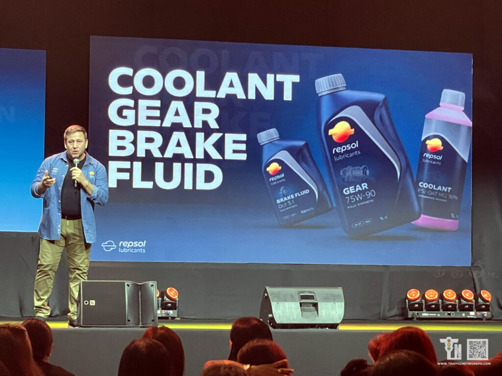 Repsol specialized motorcycle maintenance products including brake fluids, engine coolants, gear oils, and chain cleaner sprays