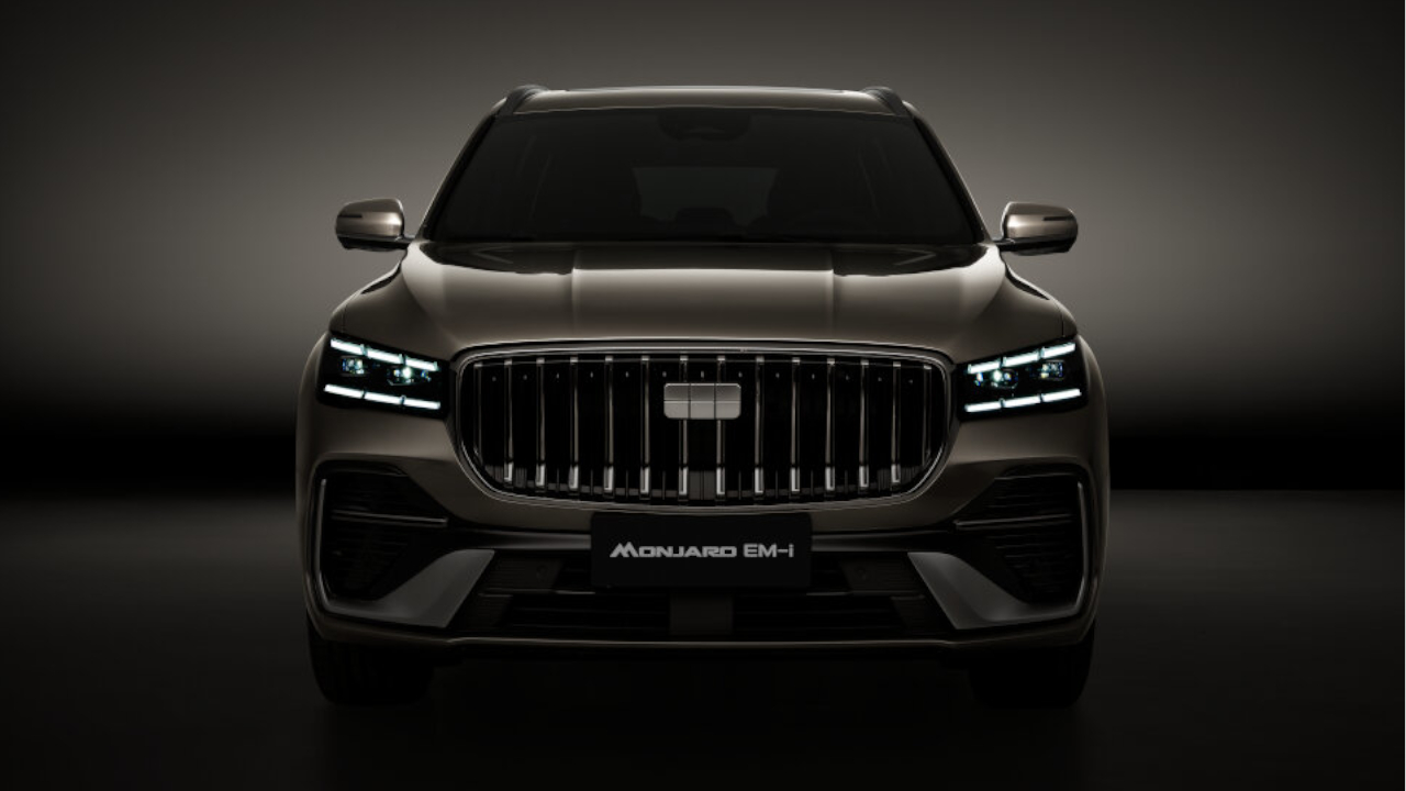 Close up view of the Geely Monjaro EM-i flagship hybrid SUV highlighting chrome grille and LED headlights.