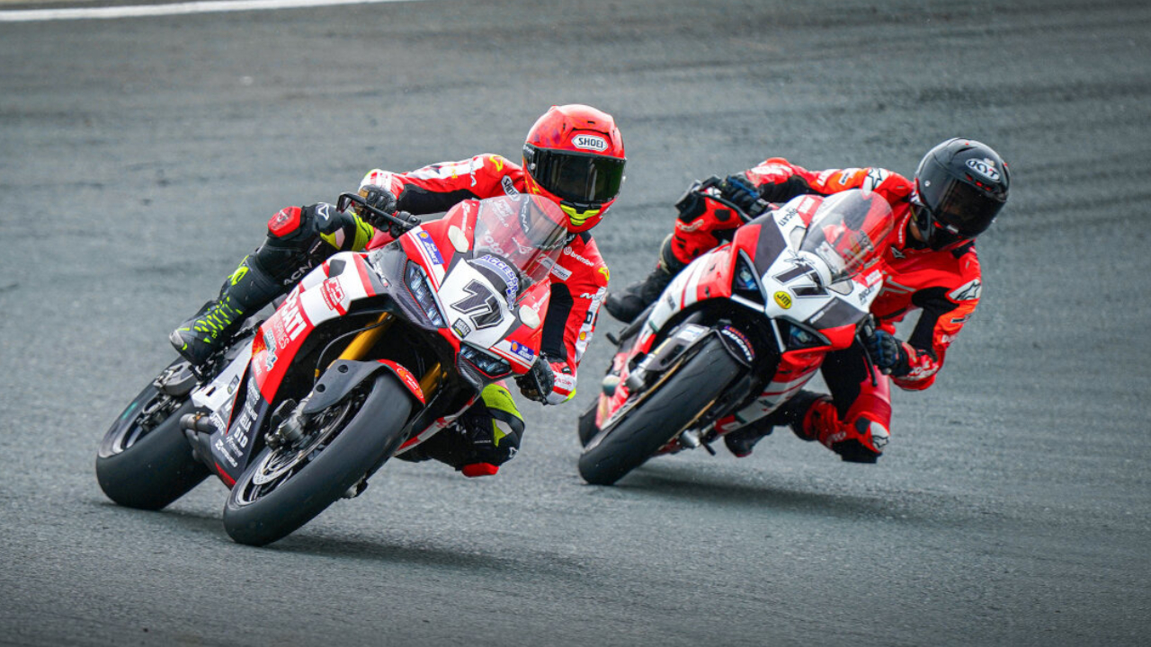 Close up view of Troy Alberto leading TJ Alberto through a wet turn on twin Ducati Panigale V2s during the 2026 Philippine Superbike Championship.