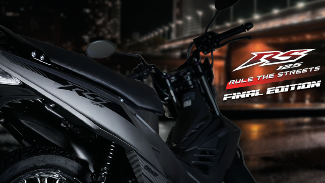 Close-up photo of the matte axis gray metallic Honda RS125 Final Edition motorcycle profile against a night city background, featuring text 'Rule the Streets FINAL EDITION' and the Honda 'How we move you' logo.